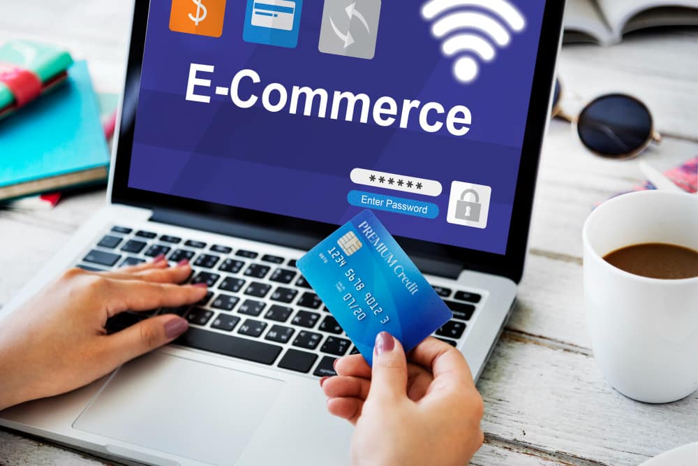 A person entering payment details on an e-commerce site with confidence thanks to the benefits of PCI DSS compliance.