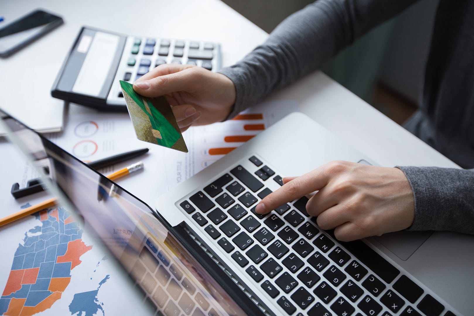 A person entering sensitive information like CVV and Date of Expiry on his credit card and getting an online payment processed.